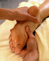 A patient getting a reflexology massage